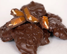 Load image into Gallery viewer, A close-up shot of our milk chocolate turtles