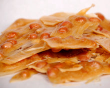 Load image into Gallery viewer, close-up shot of our famous peanut brittle