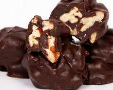 Load image into Gallery viewer, A close-up shot of our dark chocolate covered pecan clusters