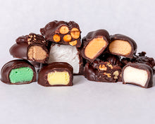 Load image into Gallery viewer, close-up shot of an assortment of some of our dark chocolate candies
