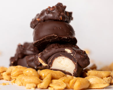 close-up shot of our famous dark chocolate peanut butter creams with peanuts