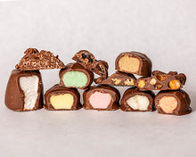 Load image into Gallery viewer, close-up shot of an assortment of our milk chocolate candies
