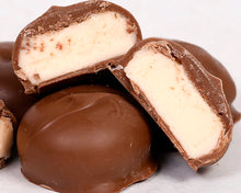 Load image into Gallery viewer, A close-up shot of our famous milk chocolate butter creams
