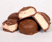 Load image into Gallery viewer, A close-up shot of our famous milk chocolate butter creams
