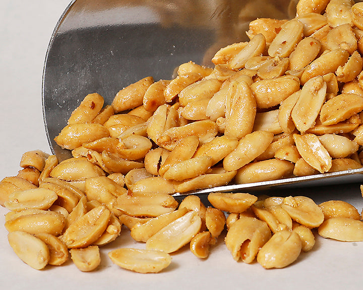 A close-up shot of our roasted hard white peanuts, roasted fresh daily